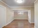 Bright bedroom featuring hardwood floors, neutral paint, recessed lighting and natural light from the window at 246 N Oak Ave, Orange City, FL 32763