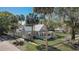 Exterior of home with white picket fence, landscaping, and palm trees adds charming curb appeal at 246 N Oak Ave, Orange City, FL 32763