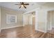 Open living room with hardwood floors, ceiling fan, and bright natural light at 246 N Oak Ave, Orange City, FL 32763