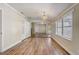Spacious living room with hardwood floors, natural light, and an open floor plan at 246 N Oak Ave, Orange City, FL 32763