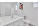 Clean bathroom featuring a modern sink, toilet, and classic white design, offering a sleek and functional space at 2616 Calistoga Ave, Kissimmee, FL 34741