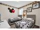 Themed ' bedroom with two twin beds and whimsical Mickey Mouse decor at 2616 Calistoga Ave, Kissimmee, FL 34741