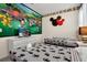 Themed bedroom with twin beds and vibrant wall decor, perfect for children at 2616 Calistoga Ave, Kissimmee, FL 34741