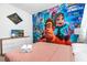 This bedroom features Disney themed wallpaper and decor at 2616 Calistoga Ave, Kissimmee, FL 34741