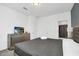Bedroom with TV, dresser, and easy access to the ensuite bathroom at 2616 Calistoga Ave, Kissimmee, FL 34741
