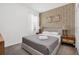 This bedroom features stylish geometric wallpaper and modern lamps at 2616 Calistoga Ave, Kissimmee, FL 34741
