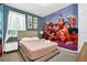 Comfortable bedroom with a queen-sized bed and Disney princess themed decor at 2616 Calistoga Ave, Kissimmee, FL 34741