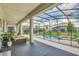 Covered patio with ample outdoor seating and a view of the pool and backyard at 2616 Calistoga Ave, Kissimmee, FL 34741