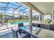 Covered patio with outdoor seating and a view of the pool and backyard at 2616 Calistoga Ave, Kissimmee, FL 34741