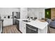 Kitchen with stainless steel appliances, a large island and ample storage space at 2616 Calistoga Ave, Kissimmee, FL 34741