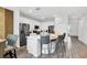 Spacious kitchen with stainless steel appliances, a large island with barstools and lots of storage at 2616 Calistoga Ave, Kissimmee, FL 34741