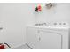 Bright laundry room features modern appliances and convenient shelving, optimizing space and functionality at 2616 Calistoga Ave, Kissimmee, FL 34741
