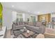 Inviting living room featuring a comfortable sectional sofa, stylish decor, and plenty of natural light at 2616 Calistoga Ave, Kissimmee, FL 34741