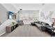 Loft area with a comfortable gray sectional sofa, tv and decor at 2616 Calistoga Ave, Kissimmee, FL 34741