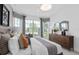 Bright bedroom featuring a large window seat, stylish decor, and a serene color palette at 2741 Serenity Meadow Dr, Kissimmee, FL 34744