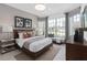 This bright bedroom features a large window seat, stylish décor, and a neutral color palette at 2741 Serenity Meadow Dr, Kissimmee, FL 34744