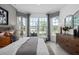 This bedroom showcases a large window seat, stylish decor, and a serene color palette at 2741 Serenity Meadow Dr, Kissimmee, FL 34744