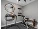 This home gym has a treadmill, stationary bike, mirrored wall and mounted yoga mats at 2741 Serenity Meadow Dr, Kissimmee, FL 34744