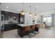 Beautiful kitchen with island seating, pendant lights, and stainless steel appliances at 2741 Serenity Meadow Dr, Kissimmee, FL 34744