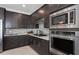 Bright kitchen featuring stainless steel appliances, a mosaic backsplash, and a gas range at 2741 Serenity Meadow Dr, Kissimmee, FL 34744