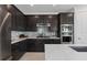 Gorgeous kitchen with mosaic tile backsplash, stainless steel appliances, and quartz countertops at 2741 Serenity Meadow Dr, Kissimmee, FL 34744