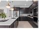 Spacious kitchen with quartz countertops, stainless steel appliances, and stylish pendant lighting at 2741 Serenity Meadow Dr, Kissimmee, FL 34744