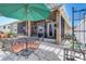 Backyard patio with a table, chairs, and view of the screened in patio at 2827 Moonstone Bnd, Kissimmee, FL 34758