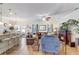 Spacious living room with hardwood floors, fan, and a cozy fireplace at 2827 Moonstone Bnd, Kissimmee, FL 34758