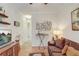 Comfortable living room with hardwood floors, modern decor, and ample lighting at 2827 Moonstone Bnd, Kissimmee, FL 34758