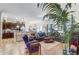 Open-concept living room flowing into the kitchen, featuring hardwood floors at 2827 Moonstone Bnd, Kissimmee, FL 34758