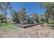 Community playground with slide, climbing structures, and benches surrounded by mature trees, great recreation at 2827 Moonstone Bnd, Kissimmee, FL 34758