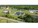 A tranquil aerial view of the home with well-maintained landscaping and a serene pond, capturing its peaceful ambiance at 2984 Monica Ter, Kissimmee, FL 34744