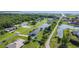 An aerial view of the property shows its beautiful location near a lake and surrounded by lush greenery at 2984 Monica Ter, Kissimmee, FL 34744