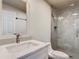 Bright bathroom featuring a vanity with stone countertop, chrome fixtures, toilet, and a glass enclosed shower at 2984 Monica Ter, Kissimmee, FL 34744