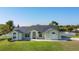 Charming single-story home featuring a well-manicured lawn, arched windows, and a neutral color palette at 2984 Monica Ter, Kissimmee, FL 34744