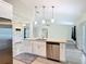 Spacious kitchen features a large island with granite countertops and stainless steel appliances at 2984 Monica Ter, Kissimmee, FL 34744