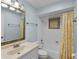 Bright bathroom with yellow accents, white tile, and vanity sink at 314 E Bonnie Trl, Longwood, FL 32750
