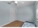 Bright bedroom with blue walls, hardwood floors, and closet at 314 E Bonnie Trl, Longwood, FL 32750