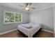Bedroom featuring hardwood floors, ceiling fan, and a window with natural light at 314 E Bonnie Trl, Longwood, FL 32750
