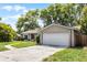 Charming single-story home with a large two car garage and lush green lawn at 314 E Bonnie Trl, Longwood, FL 32750