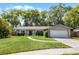 Charming single-story home with a well-manicured lawn and a two-car garage at 314 E Bonnie Trl, Longwood, FL 32750