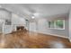 Bright living room with hardwood floors, a fireplace, and built-in bookshelves at 314 E Bonnie Trl, Longwood, FL 32750