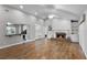 Inviting living room featuring a fireplace, built-in shelving, and hardwood floors at 314 E Bonnie Trl, Longwood, FL 32750