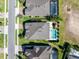 Aerial view of a private backyard oasis featuring a swimming pool and playground at 327 Island Sound Ct, Longwood, FL 32779