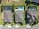 Aerial view of neighborhood homes showing private pools and backyard spaces at 327 Island Sound Ct, Longwood, FL 32779