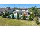 Backyard showcasing an in-ground pool, spa, outdoor seating, playground, and manicured landscaping, perfect for relaxation at 327 Island Sound Ct, Longwood, FL 32779