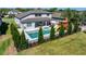 Stunning backyard featuring a modern pool, spa, outdoor seating, and a charming playground for Gathering enjoyment at 327 Island Sound Ct, Longwood, FL 32779