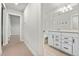 Bathroom view showcasing a white vanity, quartz countertop, and stylish fixtures at 327 Island Sound Ct, Longwood, FL 32779