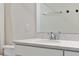 Close-up of a bathroom vanity featuring a quartz countertop and stainless faucet at 327 Island Sound Ct, Longwood, FL 32779