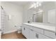 Clean, bright bathroom features wood-look flooring and a large vanity with granite countertops at 327 Island Sound Ct, Longwood, FL 32779